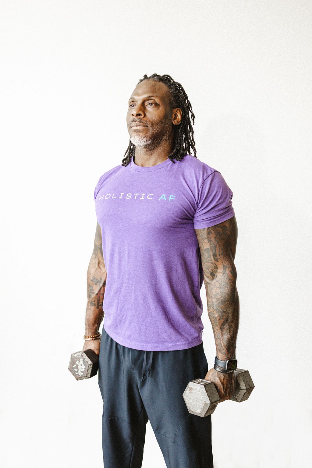 Coach Jamal holding dumbbells