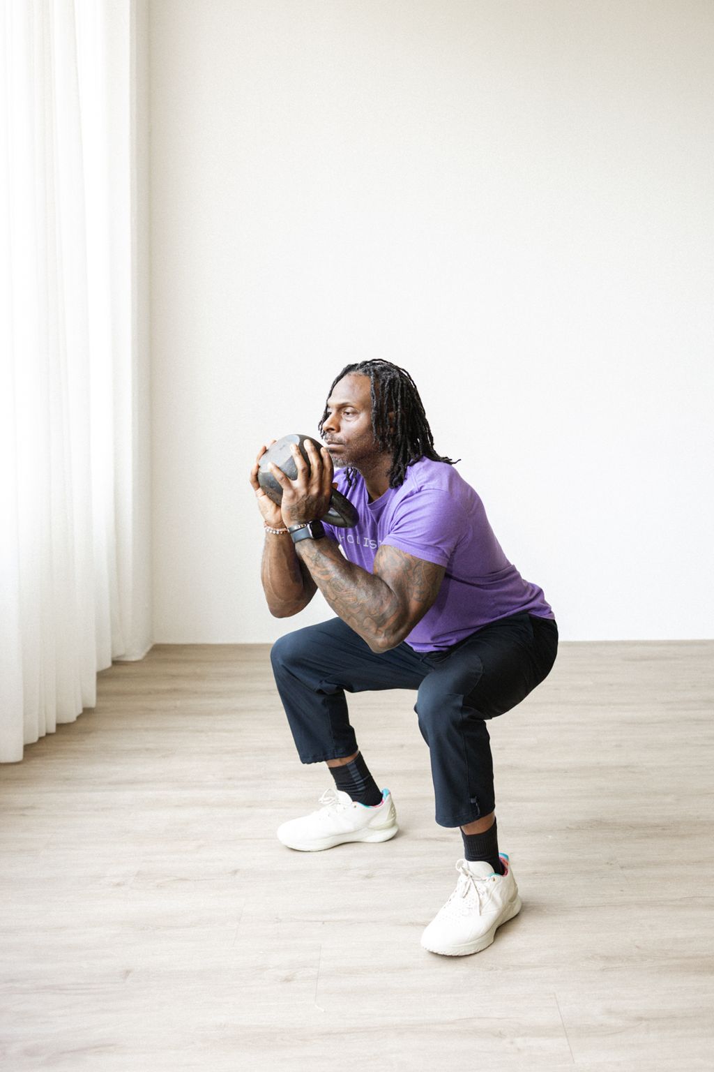 Coach Jamal doing a goblet squat