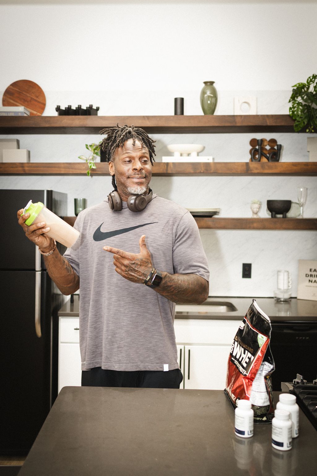 Coach Jamal in the kitchen with his supplements